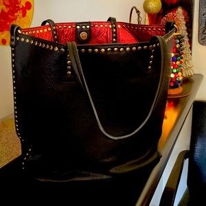 Large black leather-like bag -ultra soft. Not sure it’s leather.